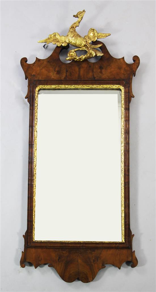 A mid 18th century fret cut walnut wall mirror, 4ft x 1ft 9.5in.